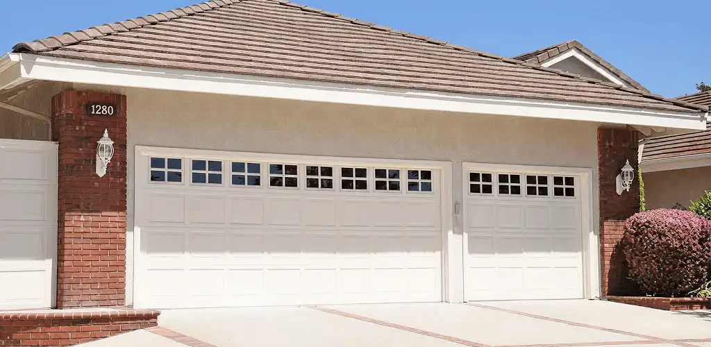 Residential garage door repair service for a double garage door in Tulsa, OK