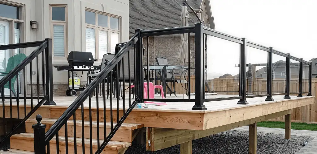 Handrail installation on a deck staircase for safety and code compliance in Tulsa, OK