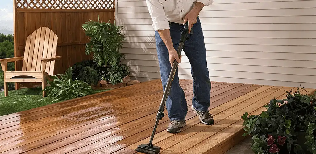 Deck staining service applying stain to a backyard wood deck in Tulsa, OK